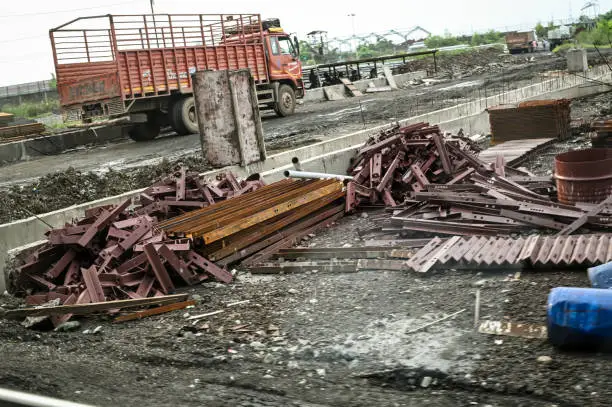 Junk and construction waste removal in Post Falls - ID as a crew loads renovation debris into a trailer